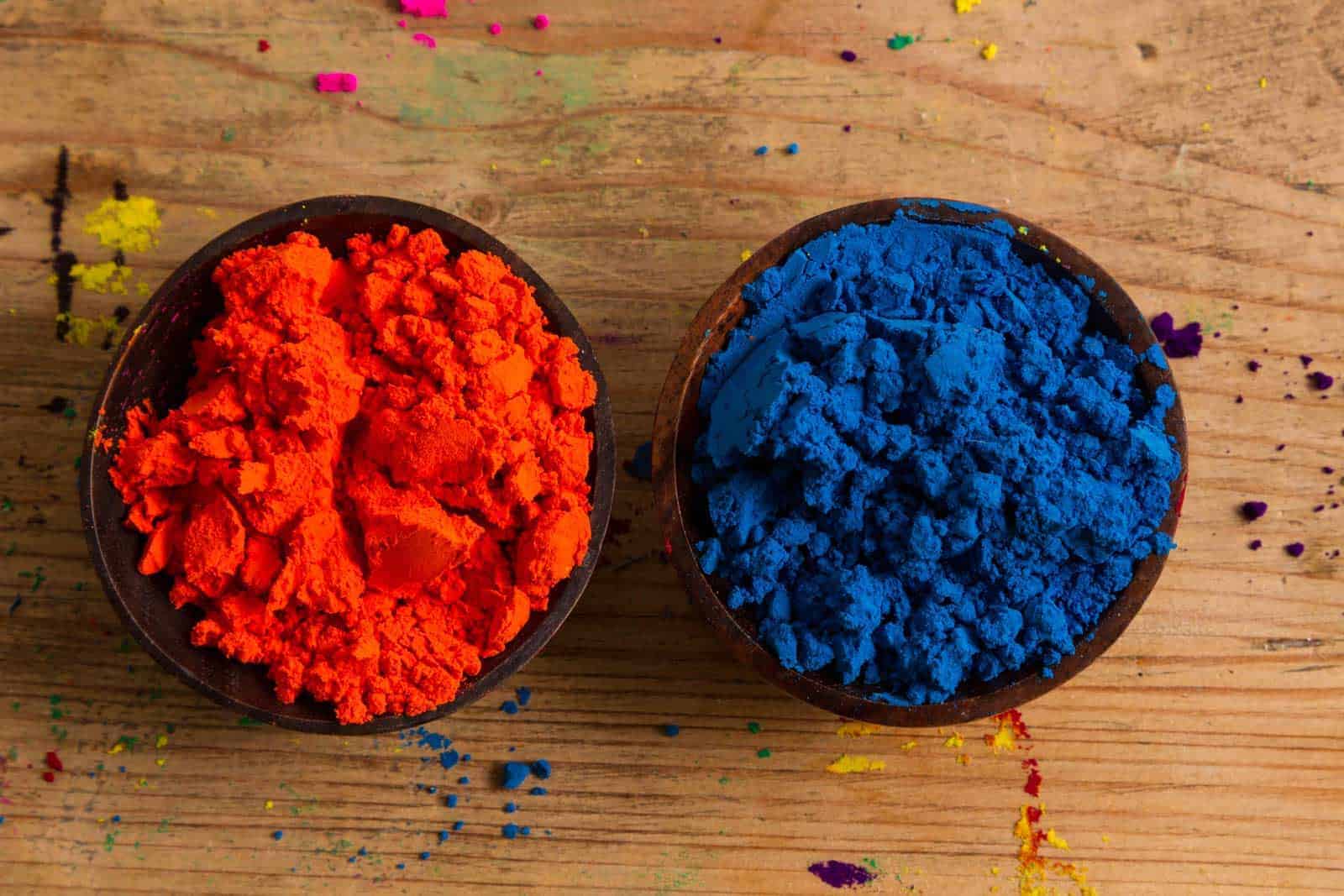 Real world example of complementary colours: Indian pigments in orange and blue.