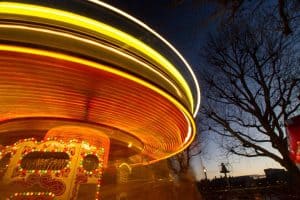 The light trails at a fun fair: beautiful and engaging.